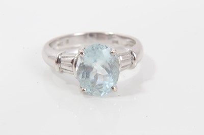 Lot 272 - Aquamarine single stone ring with an oval mixed cut aquamarine measuring approximately 10.05mm x 7.85mm x 5.35mm, in four claw setting with faceted shoulders on plain 18ct white gold shank. Ring si...