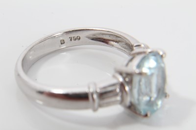 Lot 272 - Aquamarine single stone ring with an oval mixed cut aquamarine measuring approximately 10.05mm x 7.85mm x 5.35mm, in four claw setting with faceted shoulders on plain 18ct white gold shank. Ring si...