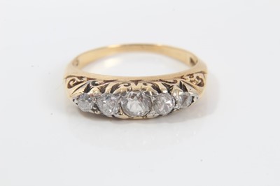 Lot 269 - Late Victorian diamond five stone ring with five graduated old cut diamonds in carved gold claw setting on 18ct gold shank, ring size K.