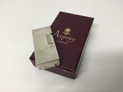 Lot 384 - Vintage Dunhill silver plated pocket lighter with engine turned decoration, 5.5cm high, in Asprey card box