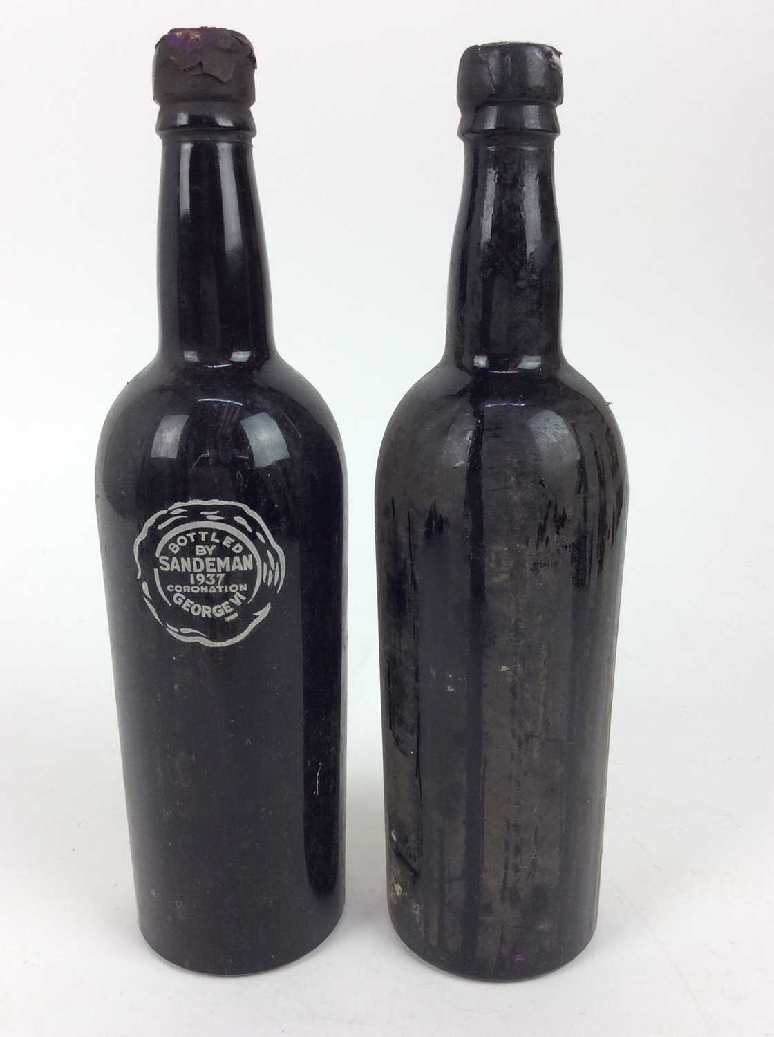 Lot 127 - Port - two bottles, Sandeman George V Jubilee 1935, bottled 1937 George VI Coronation, together with another bottle lacking label