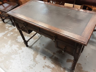 Lot 1091 - 1930s Oak writing table with leather lined top, four drawers below on spiral twist supports