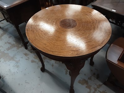 Lot 1092 - Walnut and mahogany centre table with circular top on carved cabriole legs, 75cm diameter