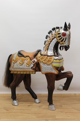 Lot 618 - Highly decorative carved and polychrome painted wooden horse