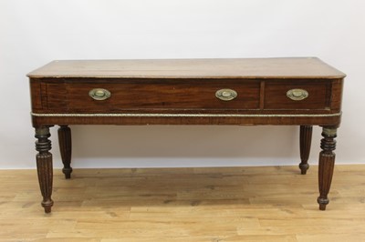 Lot 222 - Regency mahogany flatbed piano converted to a side table, rounded rectangular form with one long and one short drawer on reeded legs and spool feet, 171cm wide x 69cm deep x 80cm high