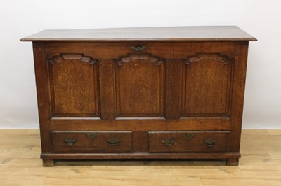 Lot 626 - 18th century oak mule chest, with triple arched panel front and hinged plank top enclosing fitted lidded candle box, two drawers below on stiles, 145cm wide x 53cm deep x 90cm high