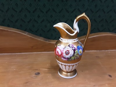 Lot 140 - Early 19th century Coalport miniature jug with floral decoration on white and gilt ground