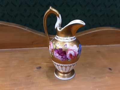 Lot 140 - Early 19th century Coalport miniature jug with floral decoration on white and gilt ground