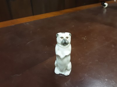 Lot 141 - Early 19th century novelty porcelain whistle in the form of a begging dog and three other dog ornaments