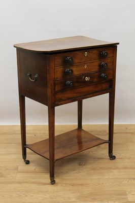 Lot 701 - Regency mahogany and tulipwood crossbanded work table, with rounded rectangular hinged top and faux drawer front, single drawer on square legs and castors, united by a shelf under tier, 49cm wide