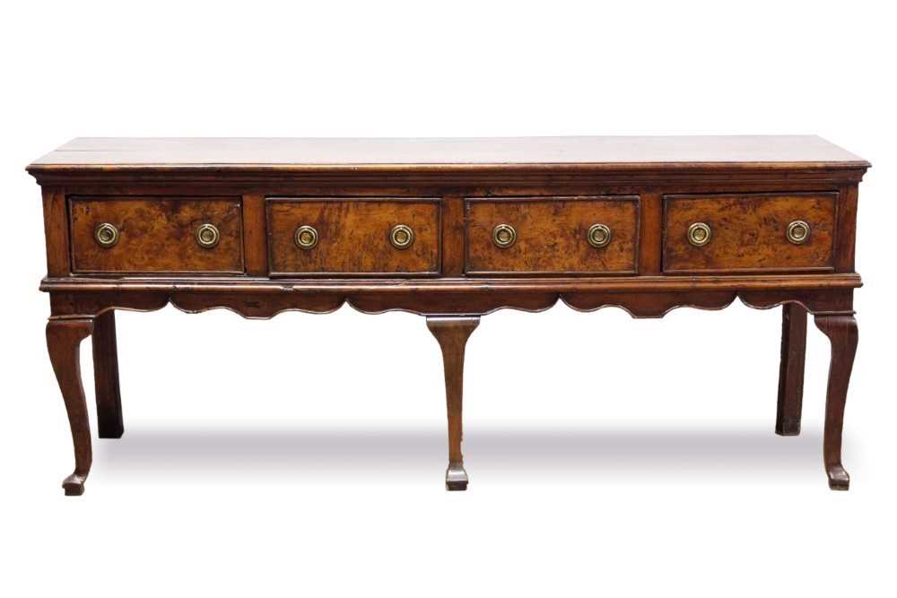 Lot 653 - Fine and rare early 18th century yew wood low dresser, with moulded top of four frieze drawers, on wavy frieze and squared cabriole legs with pointed pad feet, 198cm wide x 48cm deep x 84cm high
