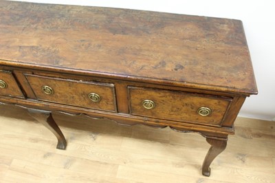 Lot 653 - Fine and rare early 18th century yew wood low dresser, with moulded top of four frieze drawers, on wavy frieze and squared cabriole legs with pointed pad feet, 198cm wide x 48cm deep x 84cm high