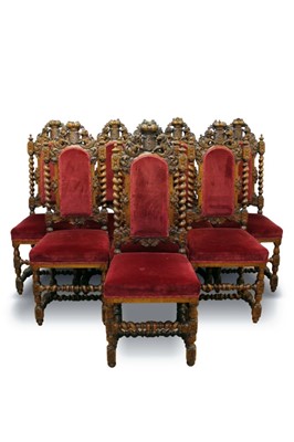 Lot 714 - Set of eight Victorian baroque style carved oak dining chairs, each with arched upholstered pad back and seat and pierced, carved and barley twist frame with heraldic cresting centred by shield and...