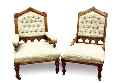 Lot 719 - Pair of Victorian arts and crafts his and hers inlaid brown oak armchairs, each with button back stuffover upholstery, arched back on turned legs and castors