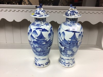 Lot 181 - Large pair of late 19th century Chinese blue and white porcelain baluster vases and covers, painted with landscape scenes, 4-character Kangxi marks