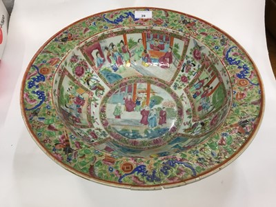 Lot 692 - 19th century Cantonese famille rose basin decorated with panels depicting figures, riveted, 42cm diameter