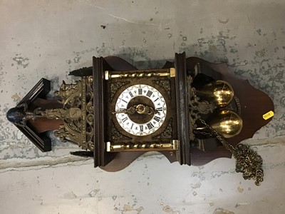 Lot 561 - A wooden wall clock with brass classical freize and Atlas figurine, Roman numeral dial and brass chain hung weights