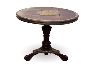 Lot 760 - 19th century Anglo-Indian teak and brass mounted breakfast table, the circular top with pierced engraved and embossed foliate and bird roundel and conforming edge, raised on angular fluted column a...