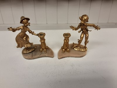 Lot 184 - Pair of 20th century gilt metal candle holders in the form of a boy and girl