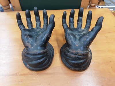 Lot 192 - Pair of cast iron hands, cast iron plaque inset with Portuguese ceramic tile, cast iron plaque depicting military band instruments on marble base, pair of wall brackets, treen nutcrackers...