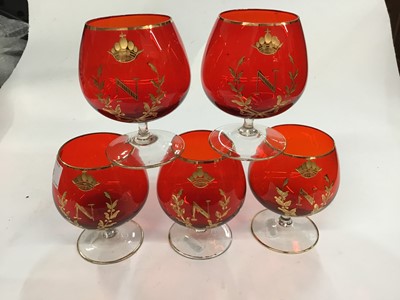 Lot 96 - Set of five ruby glass brandy balloons with gilded Napoleonic N and Crown