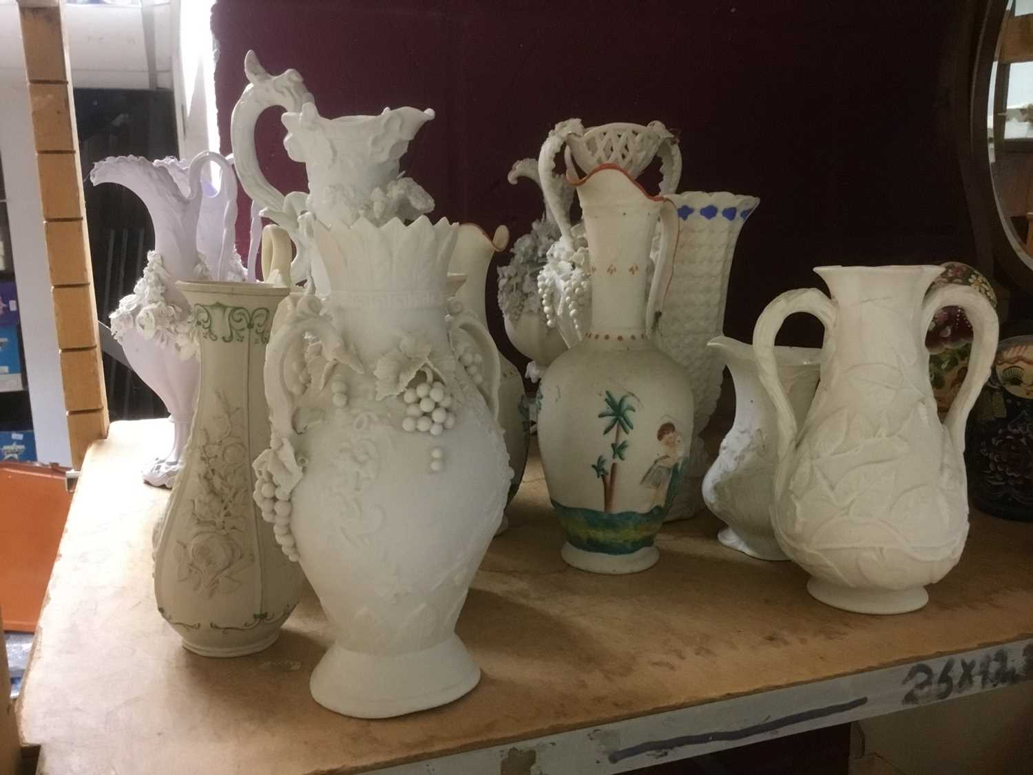 Lot 497 - Collection of Victorian white glazed Parian ware jugs, by Minton and others, with applied and moulded ornament, approximately 15