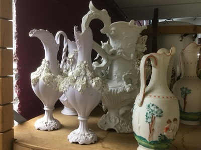 Lot 497 - Collection of Victorian white glazed Parian ware jugs, by Minton and others, with applied and moulded ornament, approximately 15