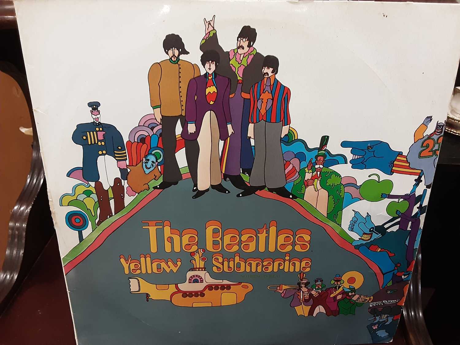 Lot 277 - Box of 7 inch single records and three LP's including The Beatles Yellow Submarine