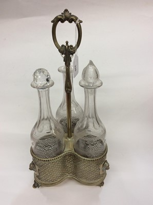 Lot 330 - Set three etched glass decanters within plated stand