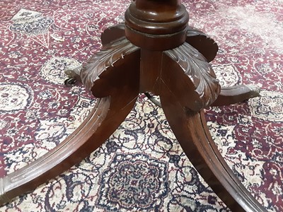 Lot 107 - Regency mahogany card table with fold over top on carved and turned column and four splayed legs, 91cm wide