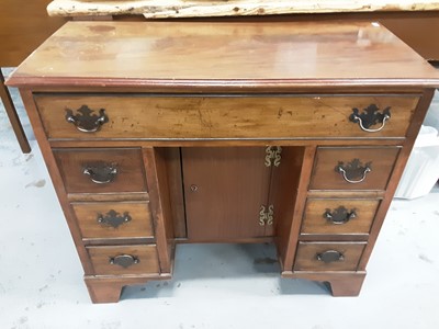 Lot 150 - Georgian style mahogany kneehole desk with seven drawers and central cupboard below, 80cm wide, 35cm deep, 71cm high