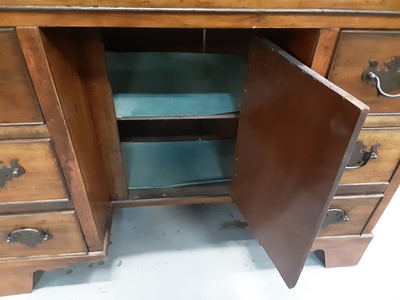 Lot 150 - Georgian style mahogany kneehole desk with seven drawers and central cupboard below, 80cm wide, 35cm deep, 71cm high