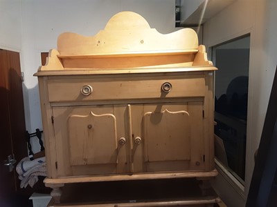 Lot 1101 - Victorian pine chiffonier with raised shaped ledge back, single drawer and two panelled doors below, 106cm wide, 49cm deep, 240cm high