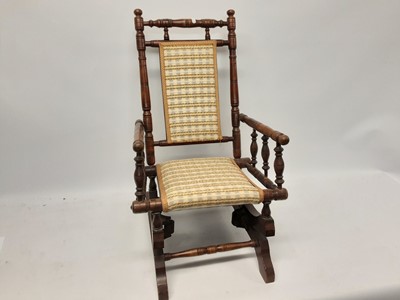 Lot 1102 - Antique children's rocking chair with turned supports