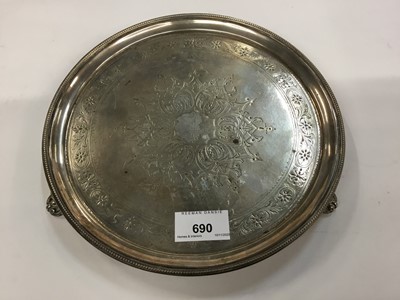 Lot 690 - George III silver salver of circular form on three scroll feet, with later engraved decoration, London 1792, maker Henry Chawner, 13ozs