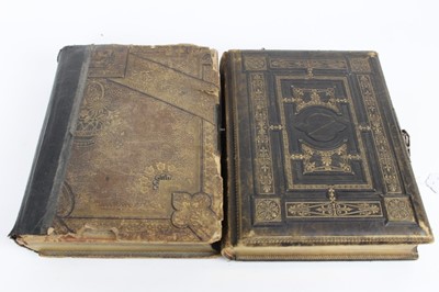 Lot 1141 - Two Victorian musical photograph albums containing carte de visites and cabinet cards.