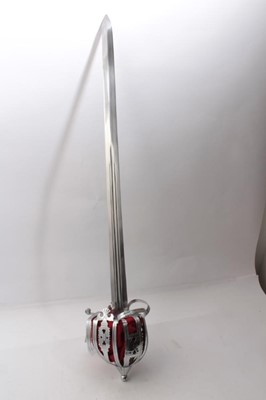 Lot 326 - Reproduction Scottish Claymore broad sword  with basket hilt, broad fullered blade in steel mounted scabbard