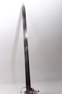 Lot 326 - Reproduction Scottish Claymore broad sword  with basket hilt, broad fullered blade in steel mounted scabbard
