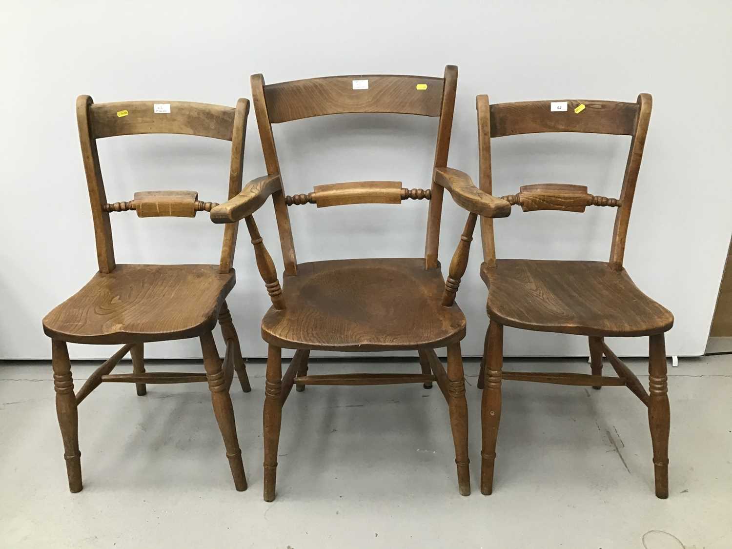 Lot 62 - Victorian elm and beech kitchen elbow chair with knife bar back together with two matching kitchen chairs