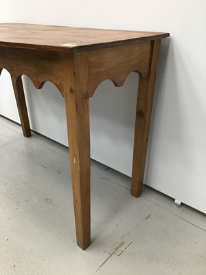 Lot 57 - Old pine bow front side table with gothic arched frieze on square taper legs