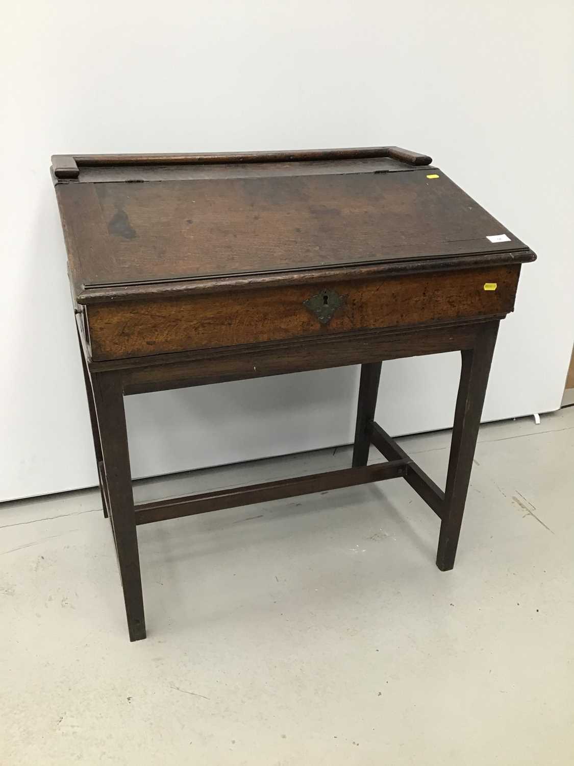 Lot 56 - Georgian oak clarks' desk with fitted interior on square taper legs