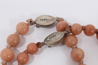 Lot 10 - Two Chinese pink hard stone and cloisonné bead necklaces, plus two cloisonné bangles