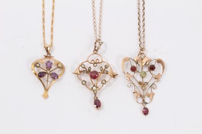 Lot 12 - Three Edwardian 9ct gold seed pearl and gem set open work pendants on 9ct gold chains