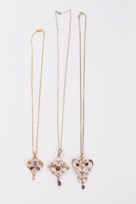Lot 12 - Three Edwardian 9ct gold seed pearl and gem set open work pendants on 9ct gold chains