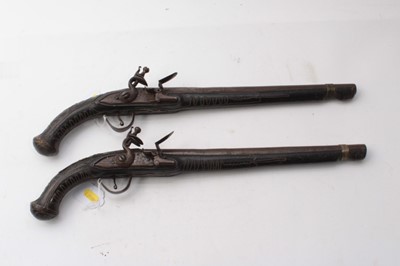 Lot 381 - Pair late 19th centuryTurkish Flintlock holster pistols with ornate brass wire work inlaid ebonised stocks 50cm overall