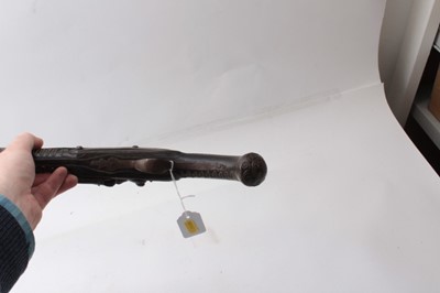 Lot 381 - Pair late 19th centuryTurkish Flintlock holster pistols with ornate brass wire work inlaid ebonised stocks 50cm overall