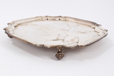 Lot 52 - Silver salver of square form, with shaped corners on four bun feet (Sheffield 1933) by Viner’s Ltd. 30.5cm across