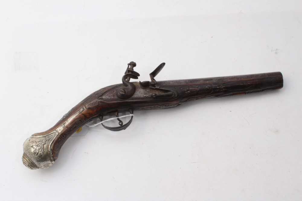Lot 384 - 19th century Turkish Flintlock pistol with silver mounts and carved walnut stock 38cm