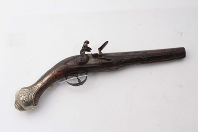 Lot 384 - 19th century Turkish Flintlock pistol with silver mounts and carved walnut stock 38cm