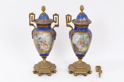 Lot 220 - Pair of 19th century Continental ormolu mounted porcelain vases and covers